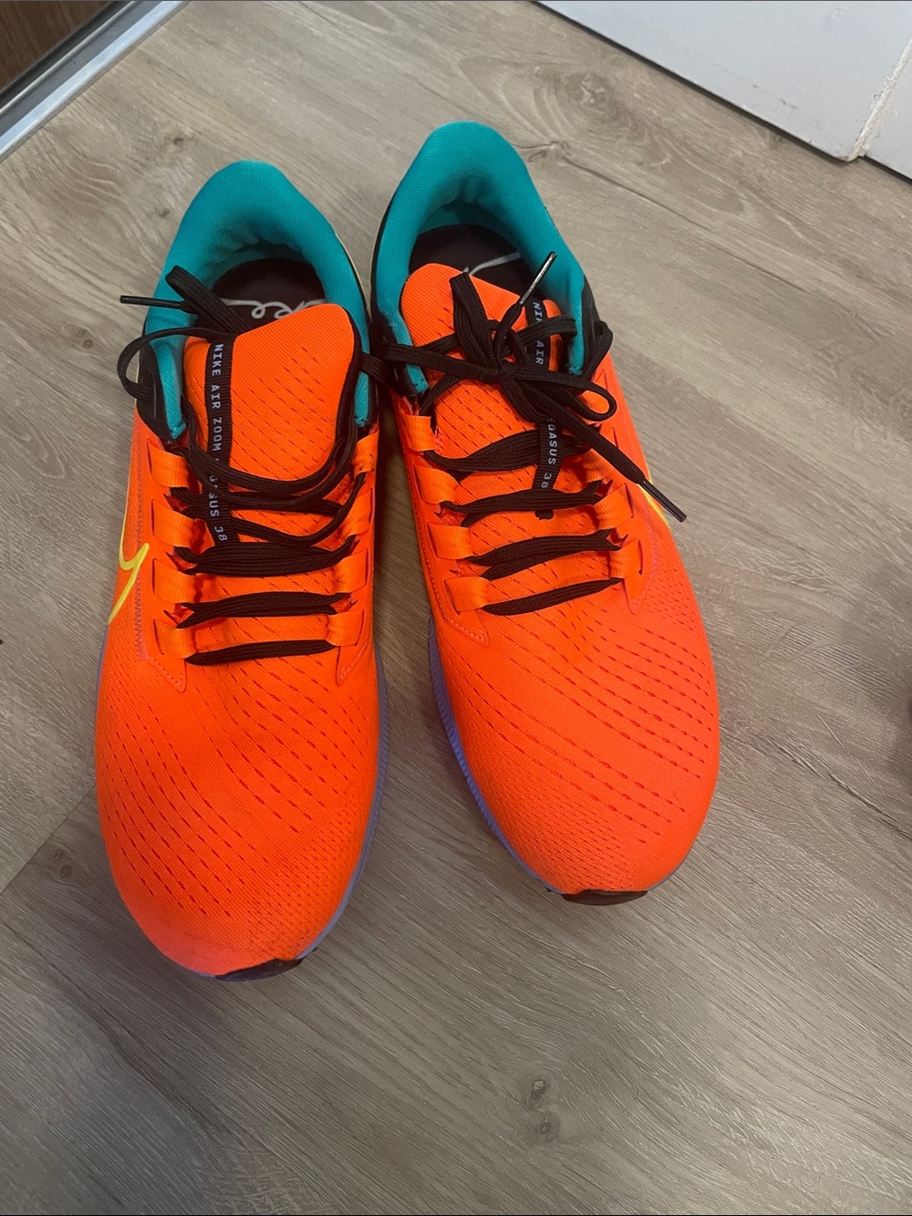 Nike Men's Orange Running Shoes with Teal Lining